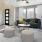 Furnished Cadia River District living room with couch, coffee table, and entertainment center.