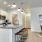 Modern kitchen with stainless steel appliances at Cadia River District in Eagle Idaho