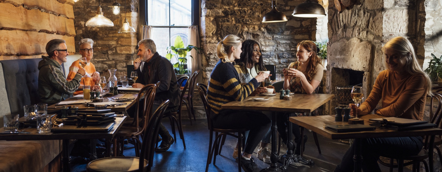 a group of people eating at a restaurant