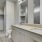 Modern bathroom with under-mounted dual vanity sinks at Cadia River District apartments in Eagle, Idaho.