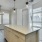 Kitchen island overlooking the living room in a townhome at Cadia River District in Eagle, Idaho.
